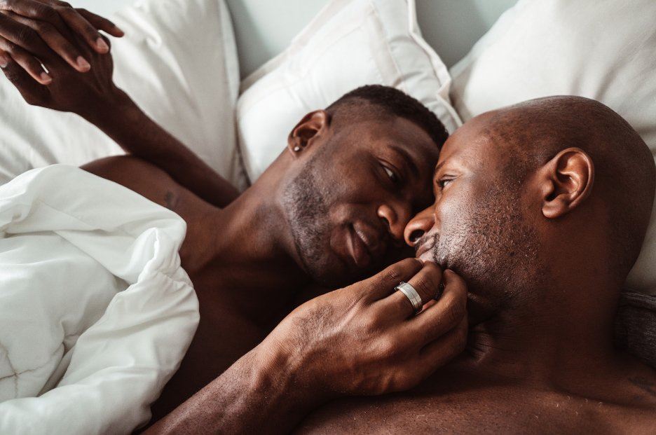 Black gay couple in bed